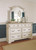 Realyn Two-tone 7 Pc. Dresser, Mirror, King Upholstered Sleigh Bed, 2 Nightstands