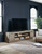 Krystanza Weathered Gray TV Stand With Wide Fireplace Insert