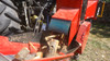 Remet RP200S Super Pro Series branch logger discharging firewood into conveyor