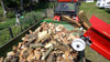 Remet RP200S Super Pro Series branch logger conveyor discharging firewood into trailer