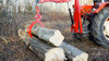 Remet C250 Tractor Crane stacking logs.