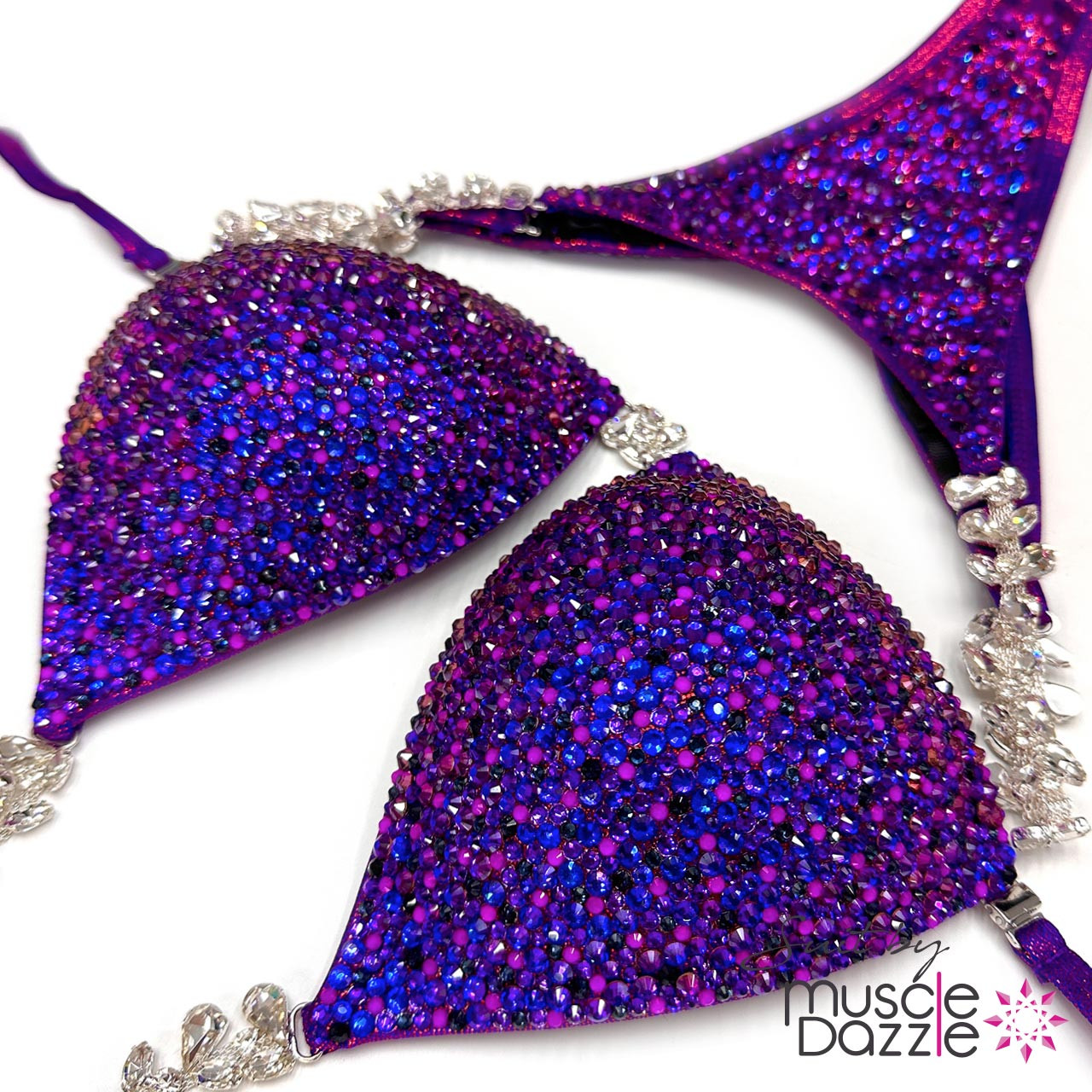 Sparkle on Stage: Muscle Dazzle's Deep Violet Crystal Bikini