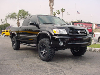 Icon Vehicle Dynamics 2.5" Coil-Over Front Suspension, Total Chaos Fabrication 4WD Diff Drop Spacer Kit, Icon Vehicle Dynamics 1.5" Rear Add-A-Leaf, Bilstein 5100 Rear Shocks, 17x8.5 American Racing Predator Wheels Teflon Finish, 285/70/17 BF Goodrich KM2 M/T Tires