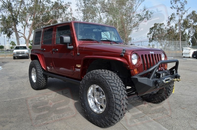 Readylift 3" Lift System w/Bilstein 5100 Series Shocks, 17" Polished Extreme Alloys #1089 Wrapped w/37-12.50-17 Nitto Trailgrappler Mud Terrain Tires, Smittybilt XRC Front and Rear Bumpers w/TJM Offroad's 9k Winch and Rigid Industries Dually D2 LED Lights, Poison Spyder Customs Front and Rear Color Matched Crusher Fenders, Amp Research Power Steps