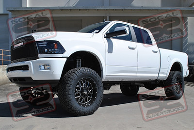 Suspension: BDS Suspension 4" Lift Suspension, 4-Link Conversion Upgrade, Dual Front Fox 2.0 Shocks, Rear Fox 2.0 Shocks, and Dual Fox 2.0 Steering Stabilizers
Wheels: KMC XD 20x9 Grenade Satin Black w/ Milled Accents +00mm 5" Backspace
Tires: Nitto 37x12.5R20 Ridge Grappler Tires
Steps: AMP Research Powerstep Electric Running Boards
Grille: T-Rex Torch Black Mesh Grille w/ 20" LED Light Bar
Bed Cover: Retrax PowerTrax Pro Mx Retractable Tonneau Cover
Exhaust: Magnaflow Black Cat-Back Exhaust System
Lights: Recon Projector Headlights and Smoked LED Tail Lights