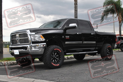 Carli Suspension Performance-2.5 3" Lift System with King 2.5 Remote Reservoir Shocks in the Front and 2.5 PiggyBack Shocks Rear, Carli Sway Bar Links, Limit Straps, Adjustable Track Bar and Progressive Mini Leaf Pack. 17x9 Fuel Throttle Black and Milled Wheels Mounted to 35x12.50x17 General Grabber Red Letter Tires, AirLift Load Bags and a Roll-N-Lock Retractable Tonneau Cover