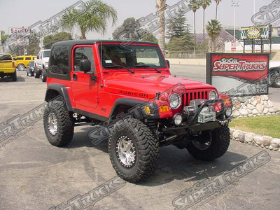 Rubicon Express 5.5" Long Arm Tri-Link Suspension System, Walker Evans Racing Adjustable Reservoir Shocks, Currie Front And Rear Differential Covers, Optima Battery, Hi-Lift Jack, Polished 17x8 Walker Evans Wheels With Black Rings, 35x12.50x17 Toyo Open Country Mud Terrain Tires.