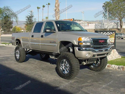 CST 11" SubFrame Lift System w/ Uni-Ball Upper Arms, SoCal's Heim Steering Kit, Custom Color Matched PowderCoat, Amp-Research PowerSteps, Deaver LeafSprings, Fox 2.0 Reservoir Shocks, Polished CST Skidplate, 40" TRXUS Tires, 20" Eagle Wheels