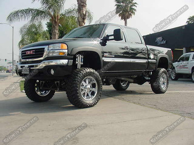 CST 9" Lift System w/ Uniball Upper Arms, Dual Shock Hoops for Chrome Fox 2.0 Shocks & Polished SoCal Reservoir Clamps, Deaver Rear Leafs, Mag Hytec Hi Capacity Tranny Pan & Diff Cover, Amp Powersteps, 37x13.50x20 Toyo M/T's on DUB "Big Homie" 20" Chrome Wheels, Custom 4" Exhaust System & Bully Dog "Power Pup" Computer Downloader