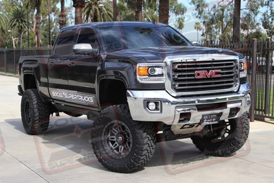 CST 10" Suspension Lift System with Dual Custom Anodized KING 2.5" Remote Reservoir Chrome Shocks with Custom Fabbed Reservoir Mounts, CST Uniball Upper Control Arms, CST Extreme Duty Tie Rod Kit, CST Aluminum Skid Plate and Rear 6.5" Lift Leafsprings. 20x10 Fuel Hostage III Matte Anthracite Wheels with Black Rings Mounted to 38x15.50x20 Toyo Open Country M/T Tires, Mag-Hytec High Capacity Diff Cover, Custom MBRP 6" Black Exhaust Tip and AMP Research Powersteps