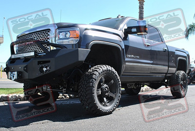 CST Performance Suspension 6" Lift Kit with 2.0 Shocks. 20x9 KMC XD811 Rockstar II Matte Black Wheels Mounted to 35x12.50x20 Toyo Open Country M/T Tires. Fab Fours Premium Pre-Runner Winch Front Bumper with a Warn 16.5Ti Winch and a 30" E-Series Light Bar. Fab Fours Vengance Series Rear Bumper with Rigid Industries Dually Diffused and Flood Lights Mounted in the Rear. 57 Gallon Titan Fuel Tank, Amp-Research Power Steps, Amp Bed Step and a Firestone Ride-Rite AirBag and On-Board Load Control System