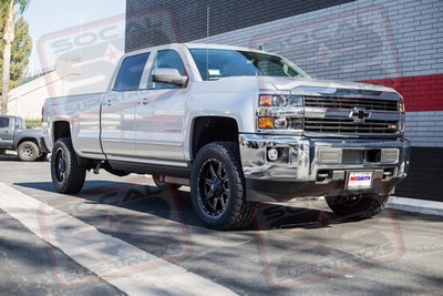 ReadyLift Torsion Key Level System with Shock Extensions, 20x9 Fuel Maverick #D538 Black and Milled Wheels with 295/60/20 (34") Toyo Open Country A/T II Tires. AMP Research Powersteps and Empire Black Billet Chevy Bowtie Inserts on the Front Grille and Rear Tailgate