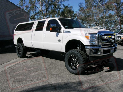 ICON Vehicle Dynamics Stage 2 7" Coil Over Conversion Kit featuring ICON's 4-Link Kit, Upgraded 2.5" Piggyback Reservoir Secondary Shock, ICON Rear Leaf Springs, Rear ICON 2.5" Piggyback Shocks, and ICON's Dual Steering Stabilizer Kit. To Accomodate The Suspension System We Added AMP Research Power Steps, A Custom Hellwig Air Bag System, And A MAG-HYTEC Rear Diff Cover. We Finished The Truck Off With BMF Novakane Death Metal Black Wheels Wrapped In 37" Toyo Open Country M/T Tires