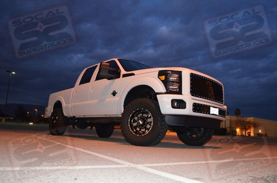 ICON Vehicle Dynamics 2.5" Leveling Kit w/2.5 Piggyback Shocks Front and Rear, 18" Black/Milled Moto Metal Style #962 Wheels Wrapped with 35" Toyo Mudterrain Tires, Amp Research Power Steps, Mag-Hytec Front and Rear Differential Covers, Magnaflow Performance Black 4" DPF-Back Exhaust System, T-rex Billet Black X-Metal Mesh Grille, Recon Lighting L.E.D Smoked 3rd Brakelight and Tow Mirror Sidemarker Lights, Custom Painted Emblems, Horn Blasters 4 Chime Shocker XL Train Horn Kit w/Viair Extreme Duty On-Board Air System