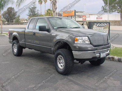 CST 7" Suspension System w/ CST Nitrogen Shocks, T-Rex Polished Billet Grill and Bumper Inserts, 17x8 Eagle #137 Wheels with 35" BFG All Terrain Tires, Hypertech Power Programmer, Custom Magnaflow Cat-Back Exhaust, and AFE Stage II Air Intake System