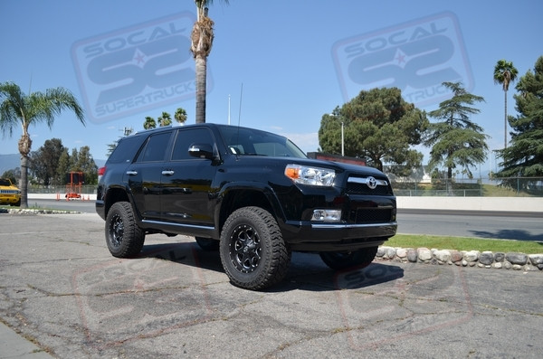Icon Vehicle Dynamics 2.5 Extended Travel Front Coilovers, Uniball Upper Control Arms, 2.5 Piggyback Rear Shocks, 2" Rear Coil Springs 17" Black/Milled Fuel "Boost" Wheels Wrapped w/285/70/17 Cooper Discoverer ST Maxx Tires, SoCal SuperTrucks Body Mount Plates.