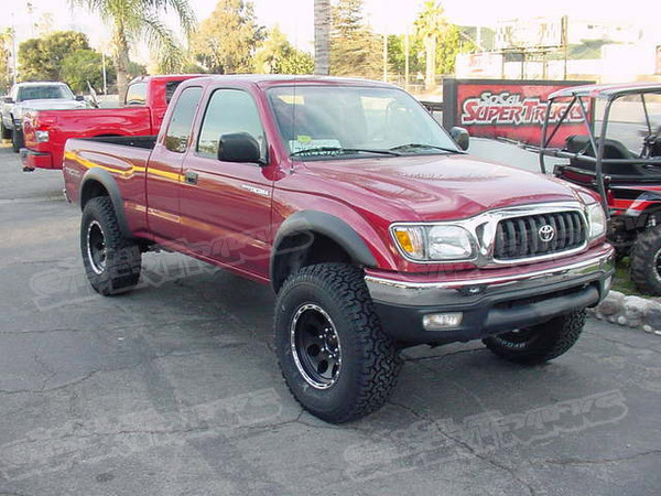 Donahoe Racing 2.5" Replacement Coilover Lift System, Total Chaos Uniball Upper Control Arms, Bilstein Rear Shocks, Black And Machined 16x8 American Eagle Wheels, 285/75/16 BF Goodrich All Terrain Tires.