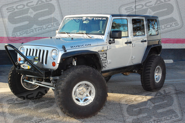 Poly Performance Short Arm Suspension System, Fox Adjustable Remote Reservoir Front and Rear Shocks, J.E. Reel Front and Rear 1350 CV Driveshafts, Genuine 5.13 Front and Rear Ring and Pinion Sets, Currie RockJock III Front & Rear D60 Axles, Currie Front and Rear Diff Covers, PSC Hydraulic Steering System, Anti-Rock Front & Rear Aluminum Sway Bar Kits, Poison Spyder  Front Stinger Bumper, Poison Spyder Crusher Front Fender Flares, Rear Fender Flares, and Rear Crusher Corner Guards, Ramsey Winch with Synthetic Rope, Poison Sypder Rear Bumper with Tire Carrier, Custom Dual Battery System, MBRP Black Series Muffler, AFE ProDry Stage 2 Cold Air Intake System,17x8.5 Walker Evans Racing Polished Beadlock Wheels, 40x13.50x17 Goodyear MTR Tires.