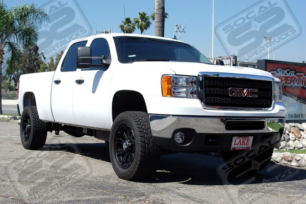ReadyLift Leveling System, 20" XD Series "Misfit" Wheels in Matte Black Finish, 305/55/20 Toyo Open Country A/T Tires, and This Rig Has Been De-Badged All The Way Around For A Smooth Look on all Sides