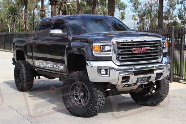 CST 10" Suspension Lift System with Dual Custom Anodized KING 2.5" Remote Reservoir Chrome Shocks with Custom Fabbed Reservoir Mounts, CST Uniball Upper Control Arms, CST Extreme Duty Tie Rod Kit, CST Aluminum Skid Plate and Rear 6.5" Lift Leafsprings. 20x10 Fuel Hostage III Matte Anthracite Wheels with Black Rings Mounted to 38x15.50x20 Toyo Open Country M/T Tires, Mag-Hytec High Capacity Diff Cover, Custom MBRP 6" Black Exhaust Tip and AMP Research Powersteps