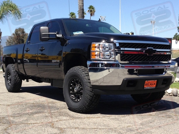 Icon Stage 3 Leveling Kit Consisting of - Torsion Keys - Billet Uniball Upper Control Arms - Front and Rear 2.5 Piggyback Shocks, Mcgaughys 1" Rear Drop Shackle, 17" Black KMC XD Series "Addict" Wheels Wrapped w/35x12.50x17 General Grabbers, MBRP Filter Back Exhaust System, Empire Motorsports Black Billet Bowtie