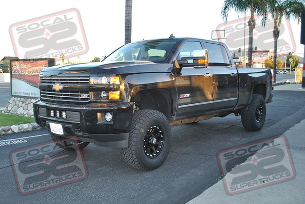 CST Performance Suspension 4-6" Lift System with Fox 2.0 Remote Reservoir Shocks. 18x9 KMC XD798 Addict Wheels Mounted to 35x12.50x18 BFGoodrich KO2 Tires. SoCal SuperTrucks Center Bumper Light Mount with Rigid Industries Dually XL Spot and Two Dually D2-XL Driving Lights