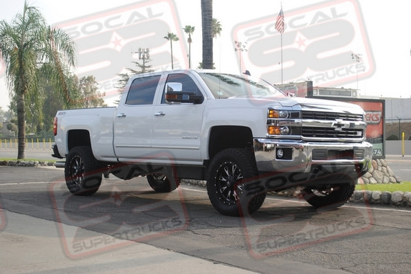 CST Performance Suspension 4" Lift System Utilizing Factory Front and Rear Shocks. 20x9 Fuel Throttle D513 Black and Machine Wheels Mounted to 35x12.50x20 Toyo Open Country ATII Tires. Empire Black Billet Bowtie Insert Finishes off the Front End