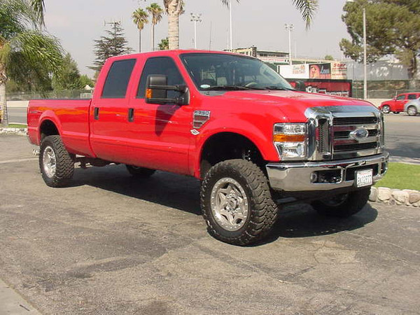 CST Performance 4.5" Suspension System, Walker Evans Racing Adjustable Remote Reservoir Front and Rear Shocks, 20x8.5 Walker Evans Racing Streetlock Wheels, 35x12.50x20 Toyo Open Country M/T Tires, Amp Research Power Step