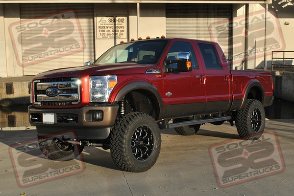 ICON Vehicle Dynamics 7-9" Coil-Over Conversion with Remote Reservoirs, 2.5" Piggy-Back Rear Shocks, 4-Link Conversion, 5" Rear Leaf Spring, Adjustable Track Bar and Dual Steering Stabilizers. 20x9 KMC XD825 Buck Gloss Black and Milled Wheels Mounted to 38x13.50x20 Nitto Trail Grappler M/T Tires. Firestone Ride Rite Airbag Kit with Level Command Controls, Custom Air Bag Spacers and a Retrax ProMX Retractable Tonneau Cover