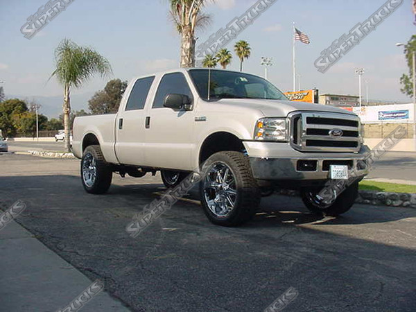 Fabtech 6" Suspension System, MHT 24" "Big Homie" Wheels wrapped with 36" Pirelli All Terrain Tires