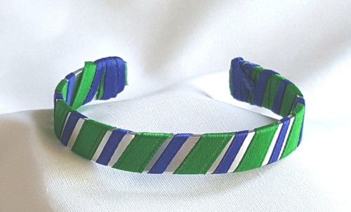 Show off your School Colors by wearing our Yellow and Blue Ribbon Cuff Bracelet.  Aluminum base with creatively decorative wrapped ribbon.

Perfect for individual inspiration, school groups/events, donation requests and for whatever your creative imagination brings.