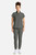 The HH752 Quest Bella Women’s Partial Zip Stand Collar Top appears in a sleek Pewter uniform set paired with Pewter pants and white sneakers. The minimalist partial‑zip collar and short‑sleeve silhouette highlight a contemporary, functional style suited for medical, service, and fast‑paced workplace settings.