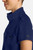 The HH752 Quest Bella Women’s Partial Zip Stand Collar Top is shown in a close‑up view emphasizing its navy blue short‑sleeve construction, smooth partial‑zip collar, and practical chest pocket holding a pen. The clean, professional detailing reinforces its purpose as a dependable uniform top for healthcare, hospitality, and other active roles.