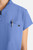 The HH752 Quest Bella Women’s Partial Zip Stand Collar Top is shown in a close‑up view emphasizing its ceil blue short‑sleeve construction, smooth partial‑zip collar, and practical chest pocket holding a pen. The clean, professional detailing reinforces its purpose as a dependable uniform top for healthcare, hospitality, and other active roles.
