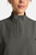 The HH752 Quest Bella Women’s Partial Zip Stand Collar Top is shown in a close‑up view emphasizing its pewter short‑sleeve construction, smooth partial‑zip collar, and practical chest pocket holding a pen. The clean, professional detailing reinforces its purpose as a dependable uniform top for healthcare, hospitality, and other active roles.