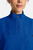 The HH752 Quest Bella Women’s Partial Zip Stand Collar Top is shown in a close‑up view emphasizing its Royal Blue short‑sleeve construction, smooth partial‑zip collar, and practical chest pocket holding a pen. The clean, professional detailing reinforces its purpose as a dependable uniform top for healthcare, hospitality, and other active roles.
