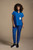 Model wearing Healing Hands Quest HH752 Bella quarter zip scrub top and HH155 Bekah jogger pants in royal blue.
