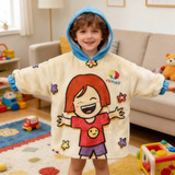 A wearable blanket featuring a cream fabric with a colourful character design and a blue hood. It has a logo.
