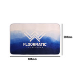 A flannel logo mat with a gradient of blue shades, featuring a logo in the centre. Dimensions are 800mm by 500mm.