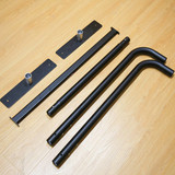 Black metal parts for a Sidewalk Cafe Barrier, including straight and curved poles with base plates.