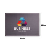 A grey floor mat featuring a colourful logo and text, measuring 900mm by 600mm, suitable for office use.