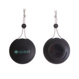 A black portable waterproof Bluetooth speaker with a hanging strap and a logo. Features a microphone and a smooth back. A black portable waterproof Bluetooth speaker with a hanging strap and a logo. Features a microphone and a smooth back.