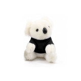 A plush koala toy in white fur, wearing a black shirt, with a small round nose and soft features.