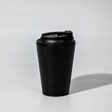 A black recycled PP 350mL coffee mug with a secured lid, featuring a logo. Ideal for hot beverages.