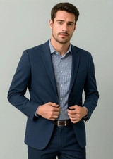 A navy men's blazer jacket worn over a light blue checkered shirt, featuring a subtle logo.
