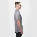 A grey men's polo shirt with a collar, featuring a subtle logo, displayed on a model from the side.