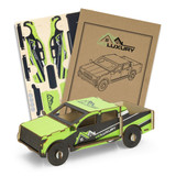 A wooden model of a UTE in green and black, accompanied by design templates in a package.