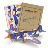 A wooden model of a Spitfire plane in blue and orange, accompanied by assembly instructions and design sheets.