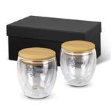 A drinkware set featuring two clear glass mugs with bamboo lids, presented in a black box.