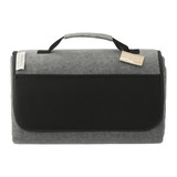 A grey oversized picnic rug with a black handle and front pocket, featuring a logo.
